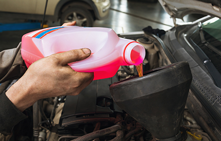 Pouring lubricant into an engine