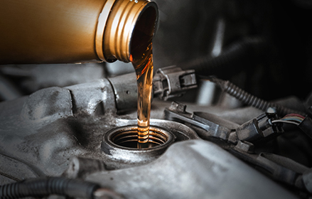 Oil being poured into an engine