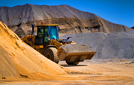 Excavator driving in the desert